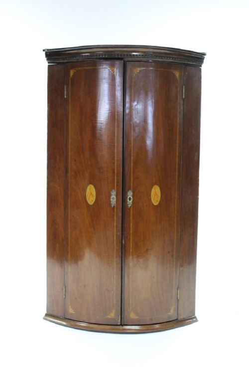 c19th inlaid mahogany barrel fronted two door corner cupboard