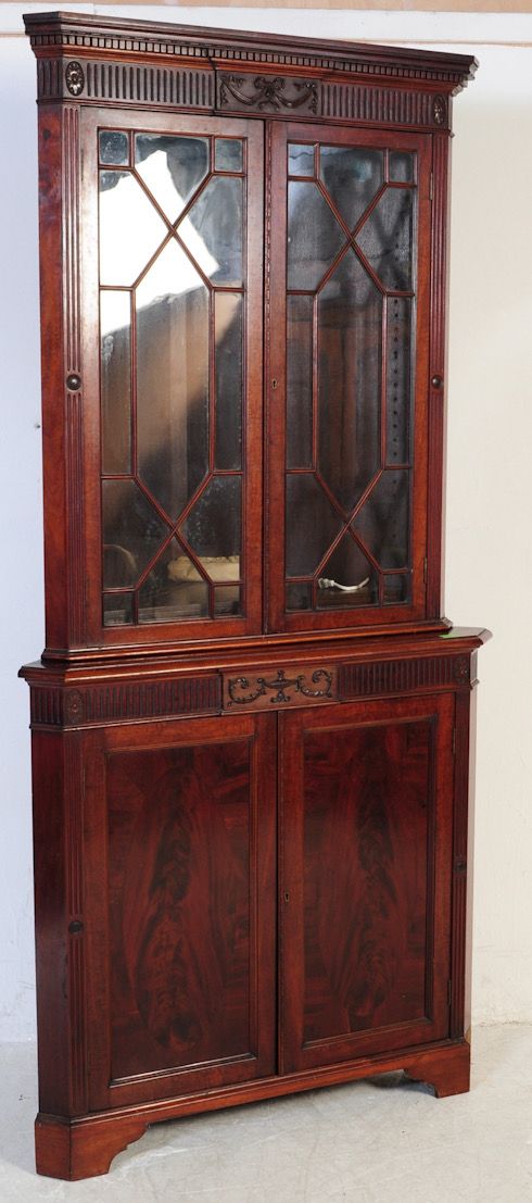 an edwardian mahogany corner cupboard