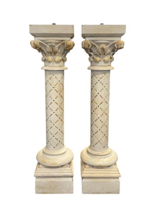 pair of carved wood and painted pedestals