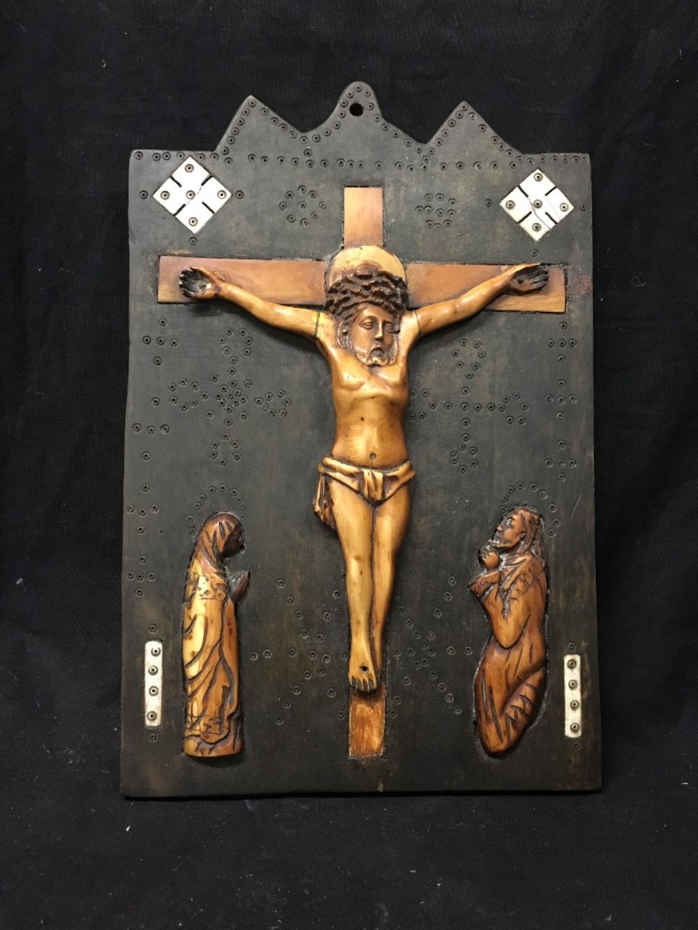 c18th bone crucifix on wooden back