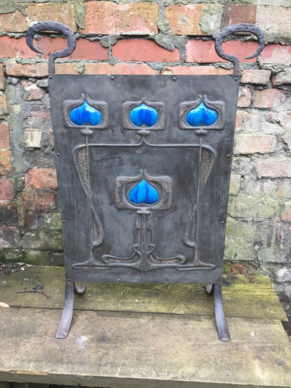 arts and crafts steel fire screen with ceramic heart inlays