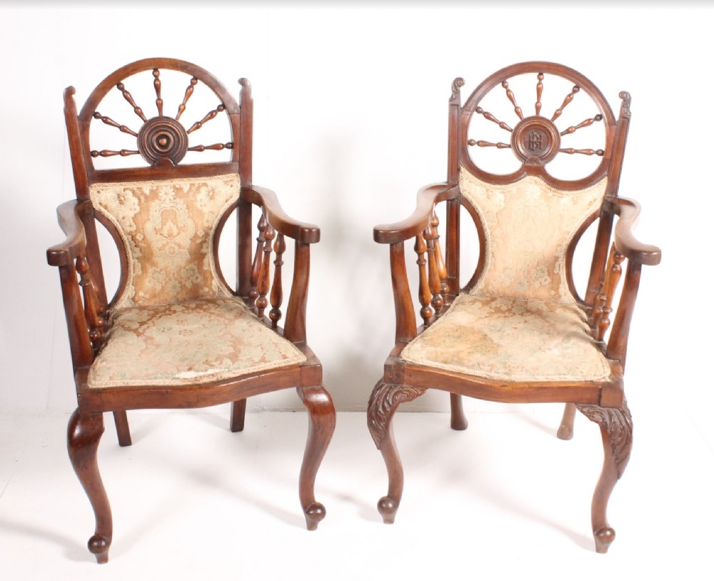 two armchairs with nautical themed backs