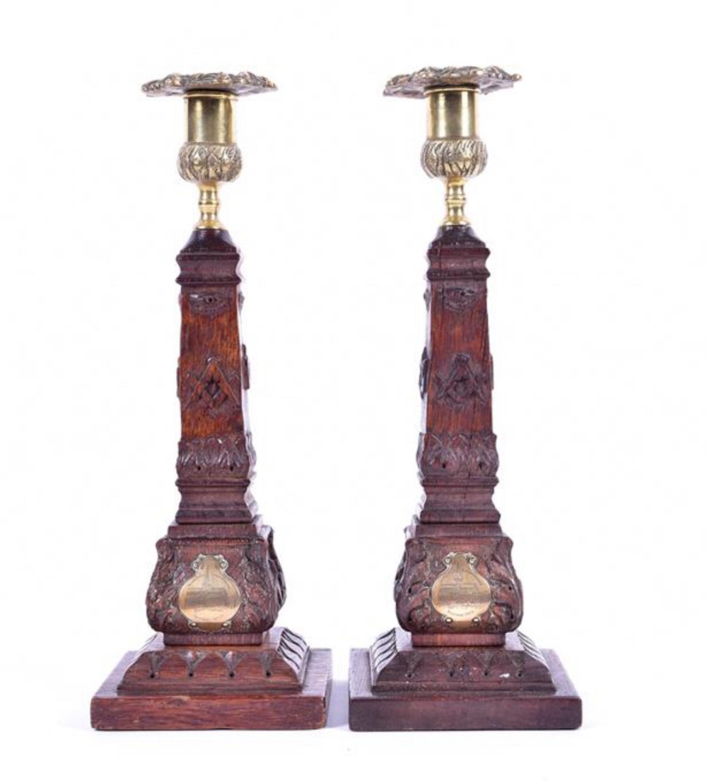 a pair of scottish masonic candlesticks