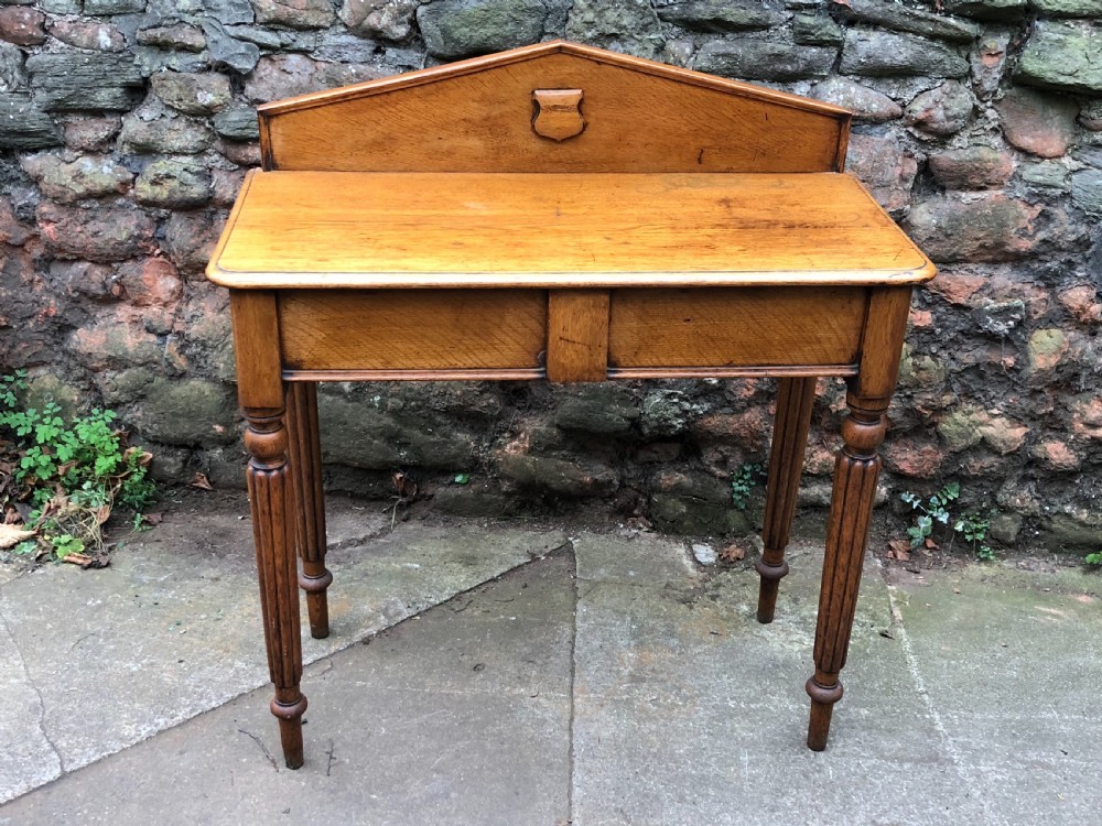 c19th golden oak hall table of small proportions on fluted legs