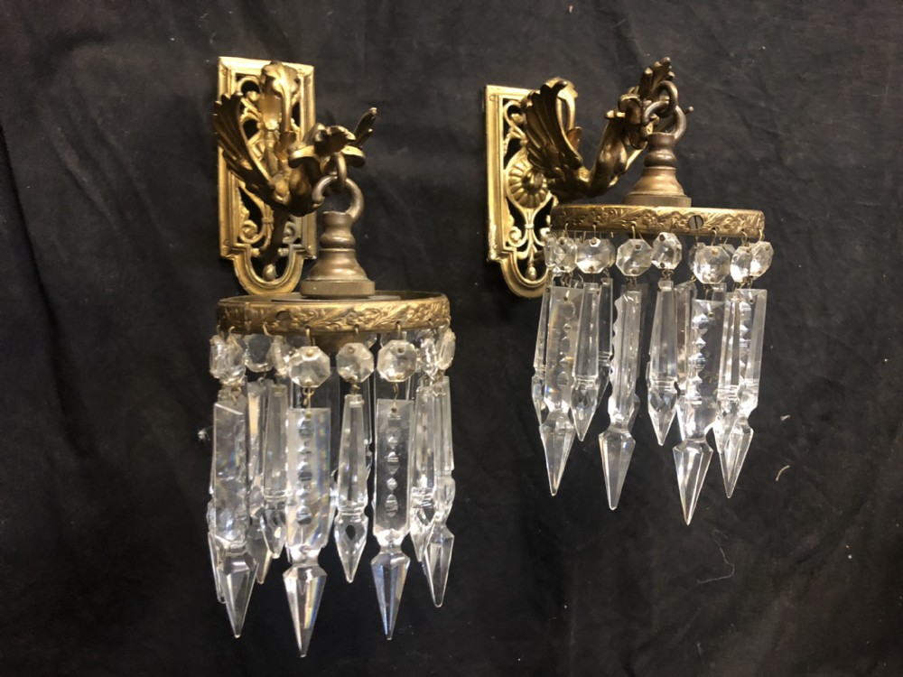 edwardian pair of wall lights shaped as griffins with cut glass lustre drops