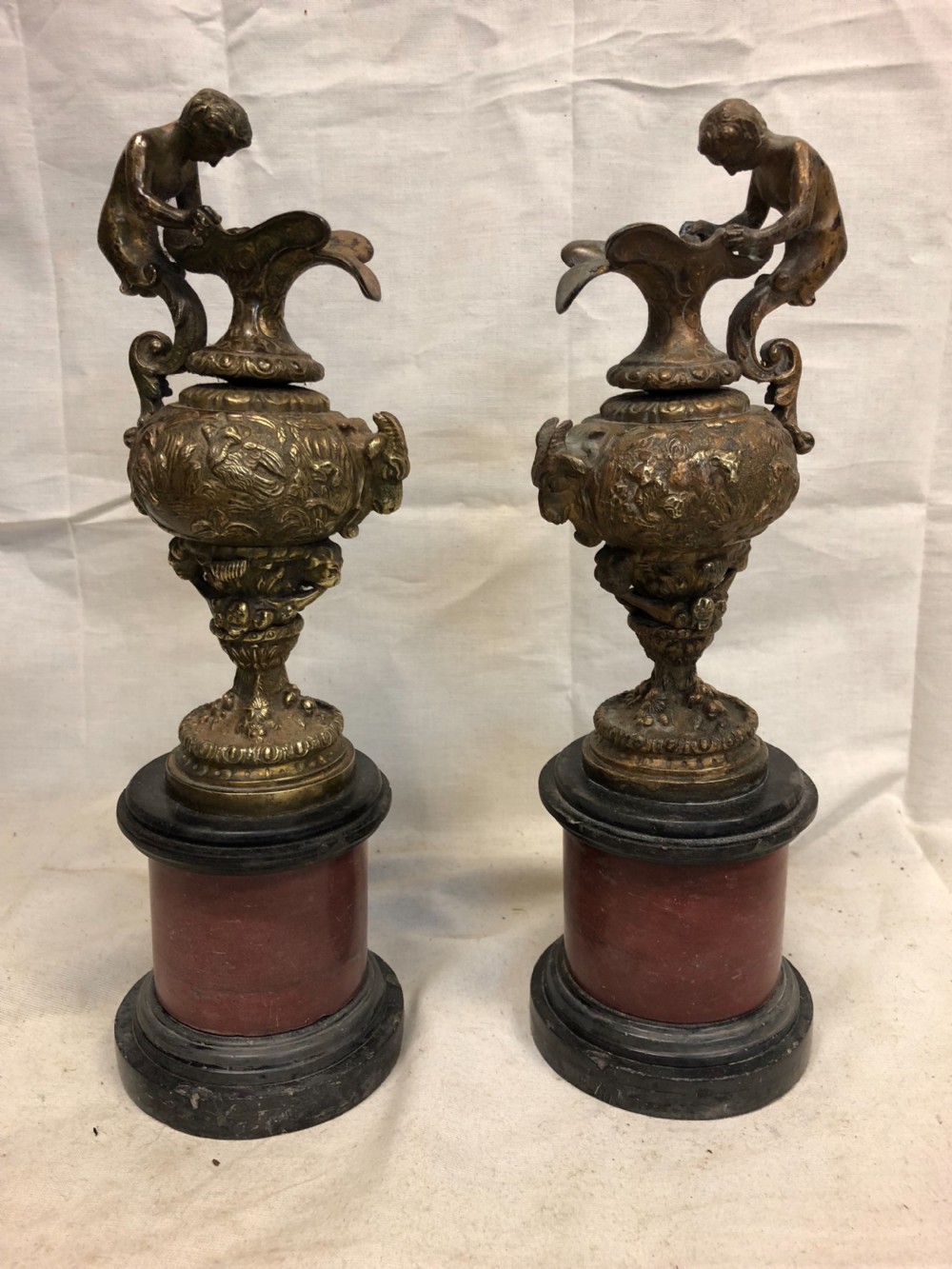 pair of classical gilt bronze urns on marble bases