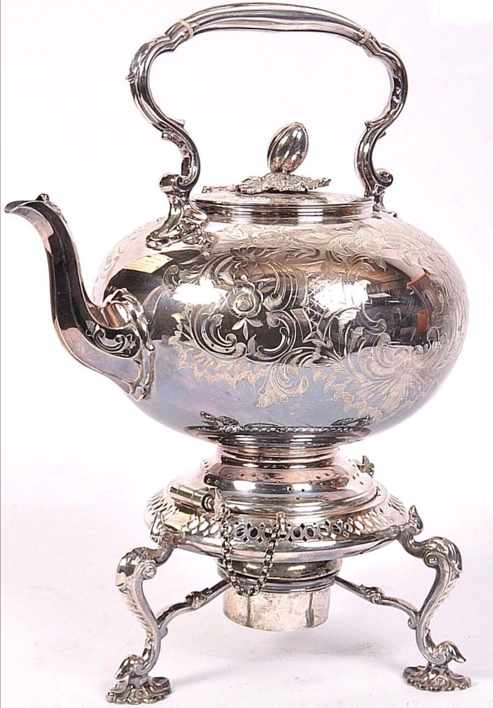 a large silver plated kettle on stand
