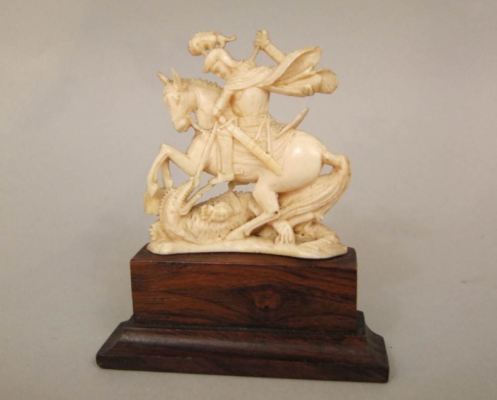 a small c19th ivory st george and the dragon carved