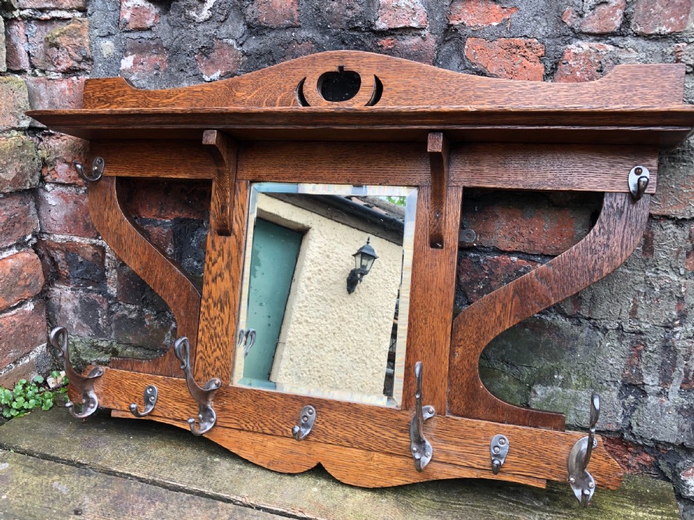 arts and crafts oak coat rack with steel coat hooks