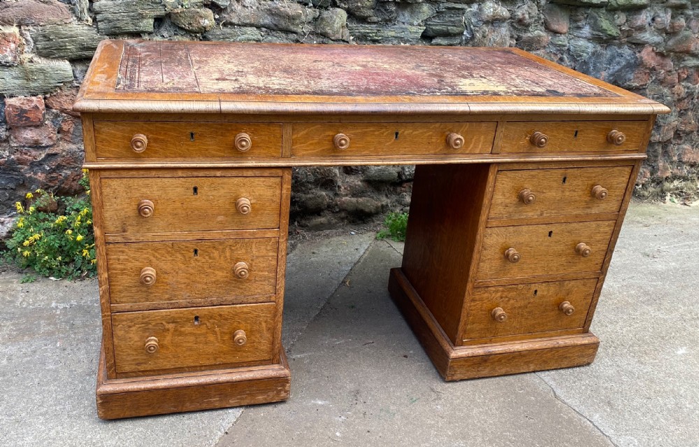 oak pedestal desk of good size and unusual back section
