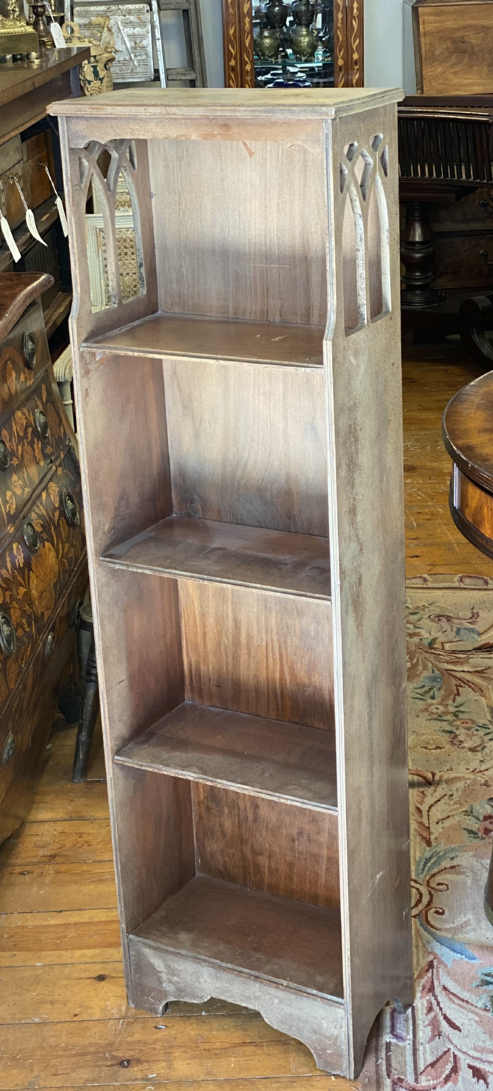 small tall bookcase with cut out gothic tracery