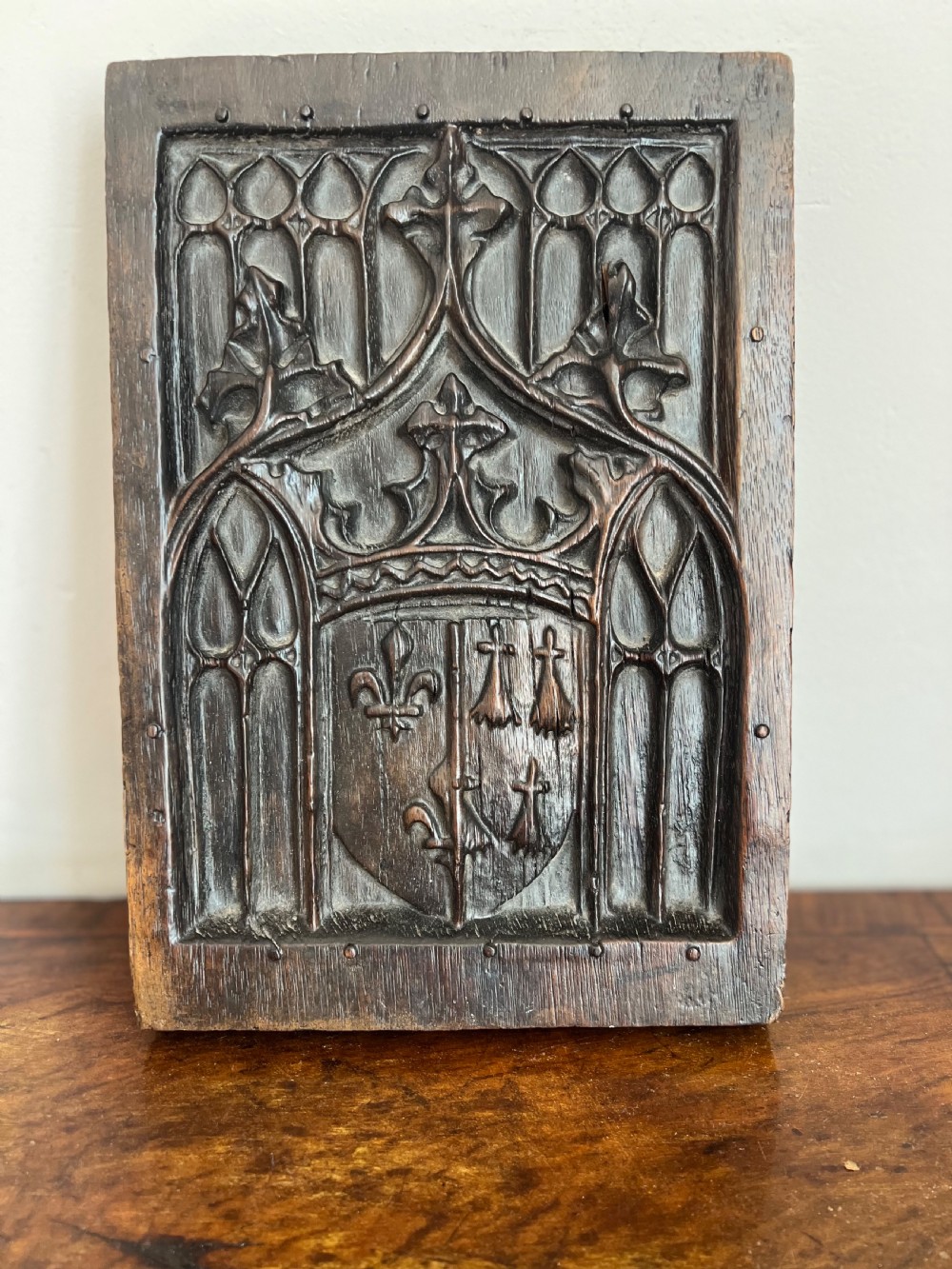 c17th oak gothic tracery panel with cresting to centre
