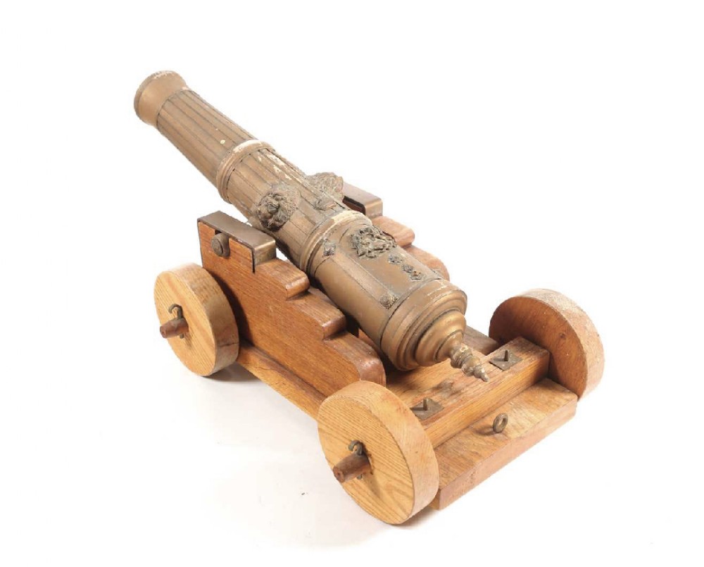 a c19th wooden model of a deck cannon