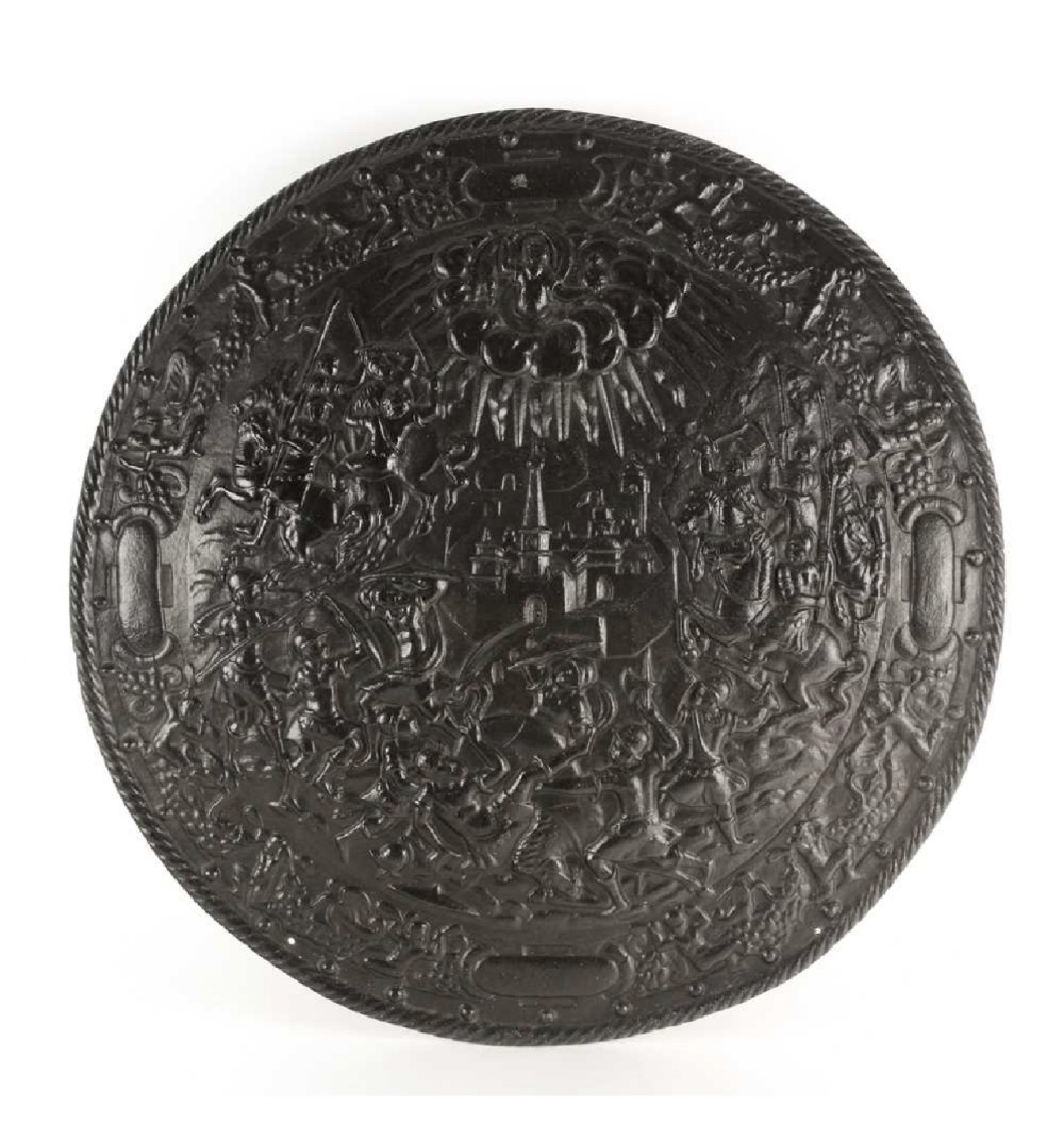 a large cast iron classical decorated wall plaque or shield