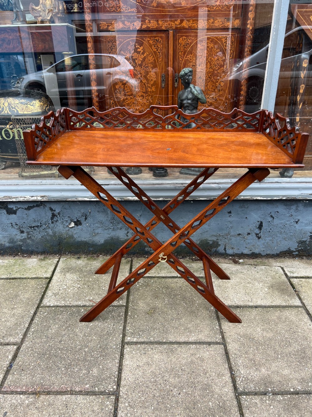 1930s fretwork mahogany tray on stand in the chippendale manner