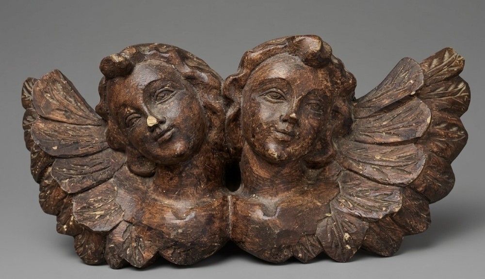 c19th carved cherub heads