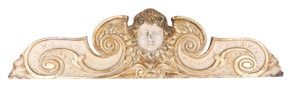 a large carved wooden over door featuring a cherub 127 cms wide